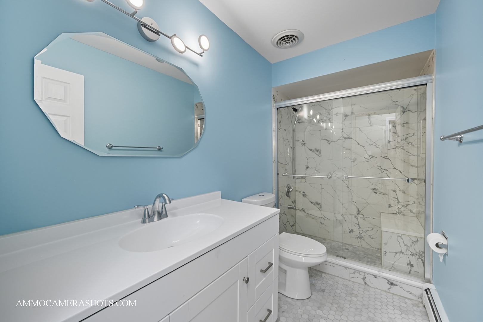 1240 South Lorraine Road, Unit 2D Wheaton, IL 60189 - Photo 13 of 19 a bathroom with a toilet a sink and mirror