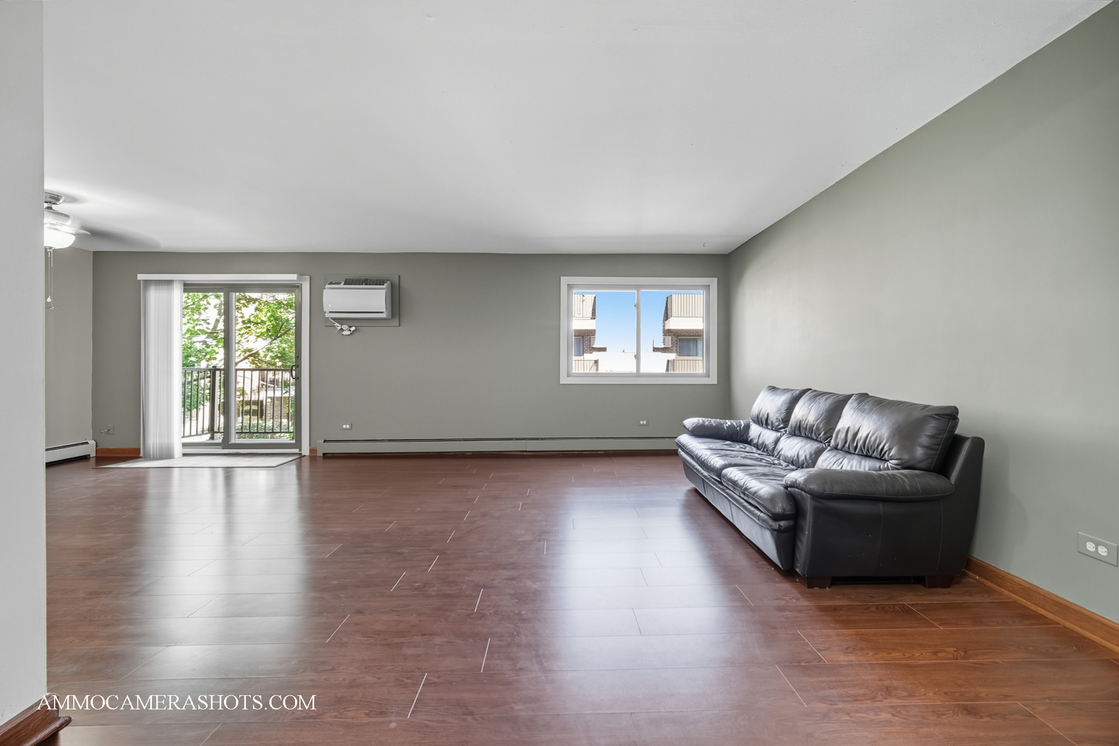 1240 South Lorraine Road, Unit 2D Wheaton, IL 60189 - Photo 4 of 19 a living room with furniture and a wooden floor