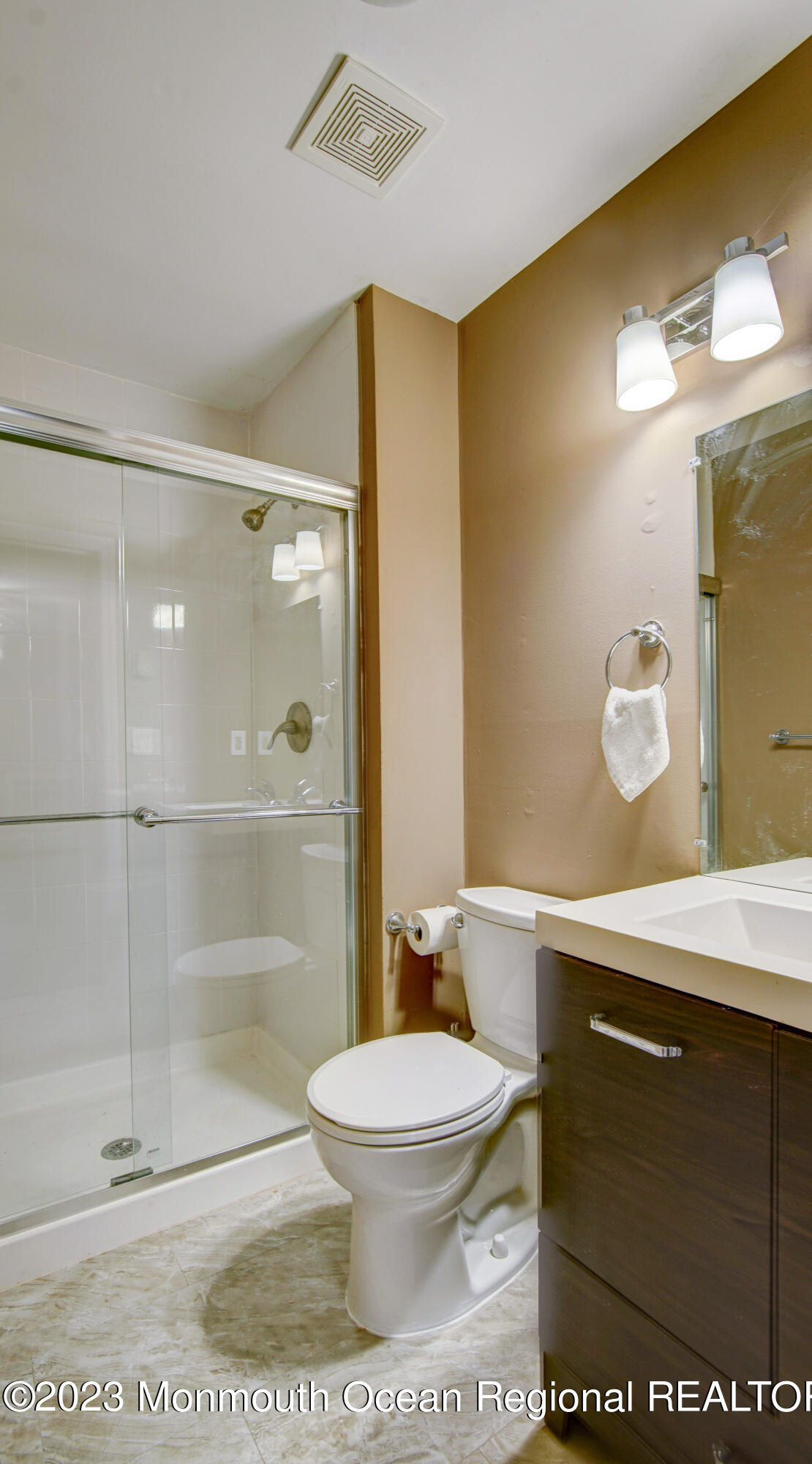 91 Arrowood Road, Unit B Manalapan, NJ 07726 - Photo 13 of 20 a bathroom with a sink a toilet and shower