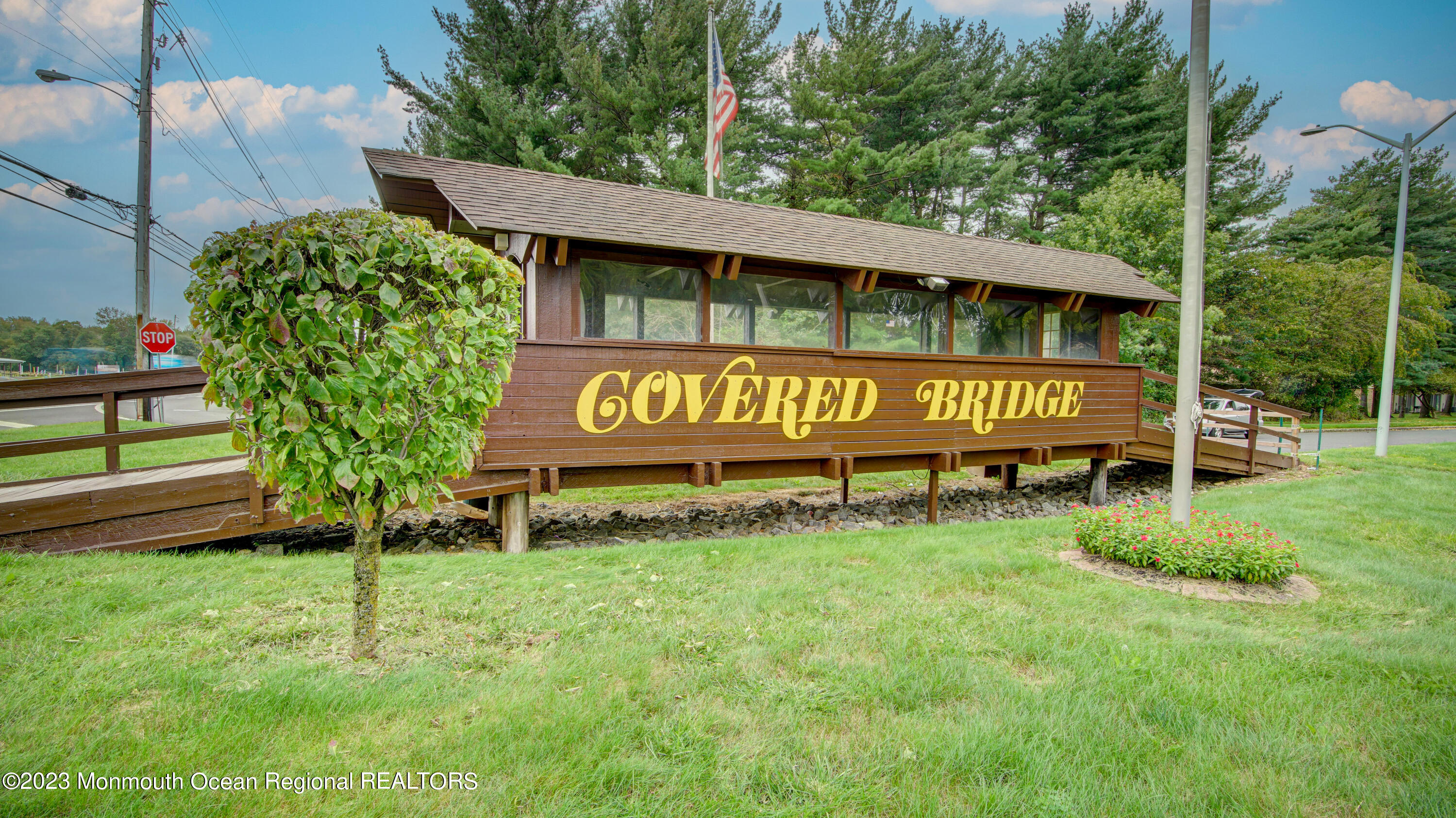 91 Arrowood Road, Unit B Manalapan, NJ 07726 - Photo 20 of 20 a sign board with a yard