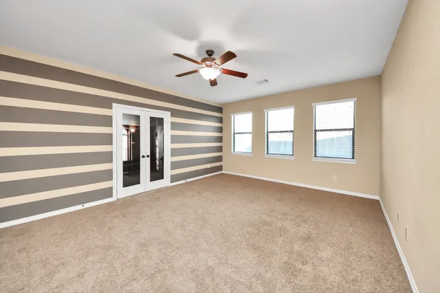 a view of an empty room with a window