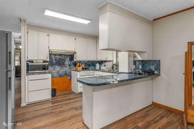 a kitchen with a stove and a microwave