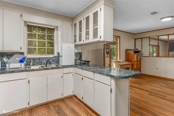 a kitchen with a stove and a microwave