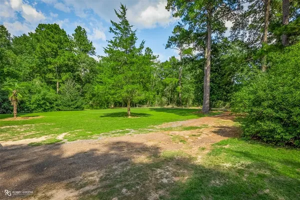 a view of a house with a big yard
