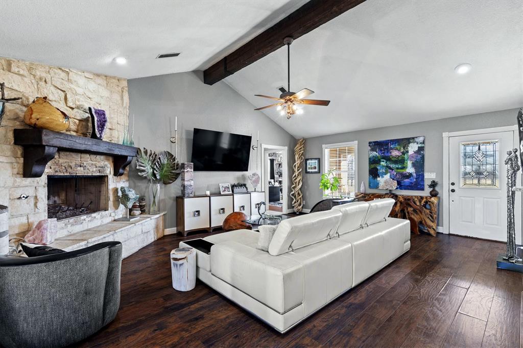 2590 Blackjack Road West Aubrey, TX 76227 - Photo 14 of 26 a living room with furniture and a flat screen tv