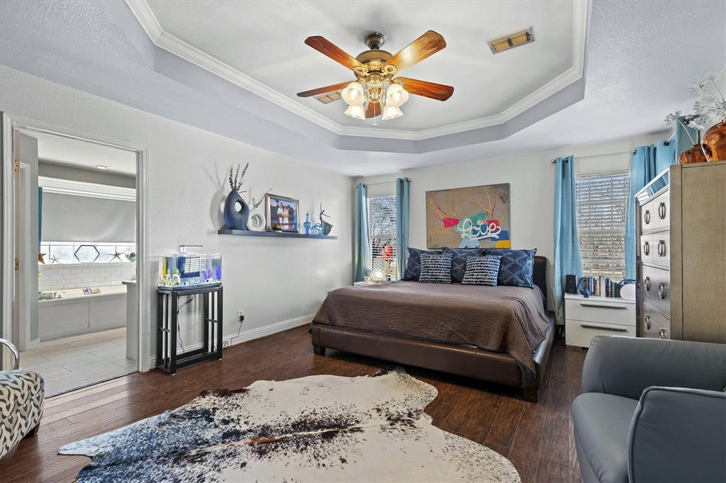 2590 Blackjack Road West Aubrey, TX 76227 - Photo 20 of 26 a bedroom with a bed and wooden floor