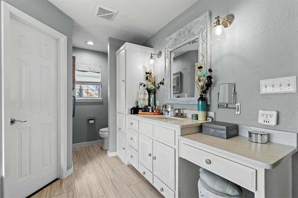 2590 Blackjack Road West Aubrey, TX 76227 - Photo 23 of 26 a spacious bathroom with a sink mirror and vanity
