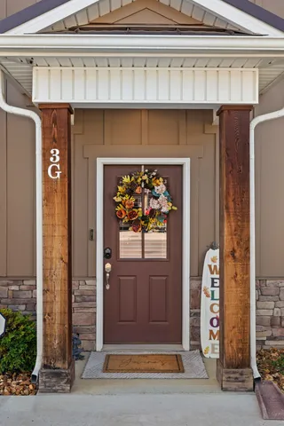 a front view of a house with a door and a window