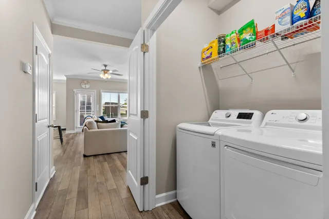 a view of living room with furniture and wooden floor