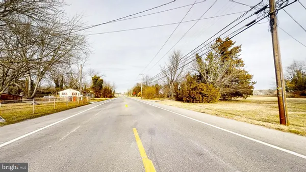 a view of a house with a road