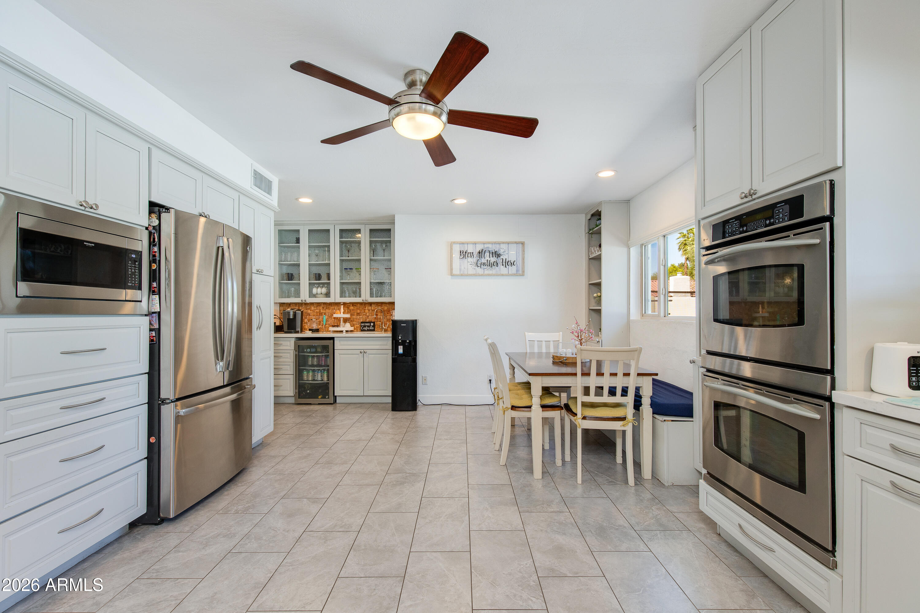 8219 North 3rd Avenue Phoenix, AZ 85021 - Photo 19 of 52 a kitchen with stainless steel appliances and a refrigerator
