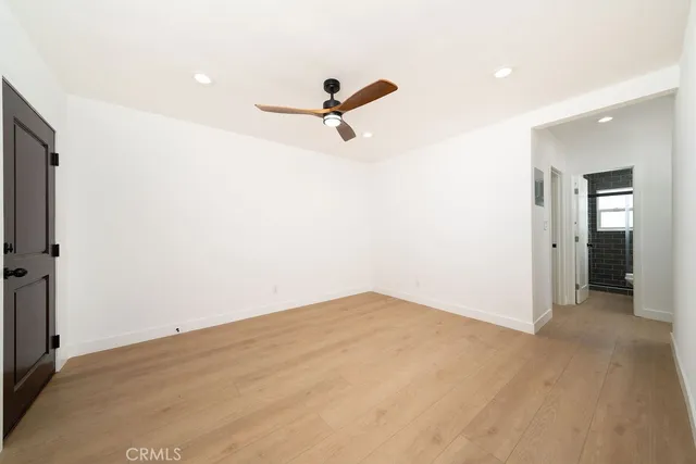 a view of a room with a sink and wooden floor