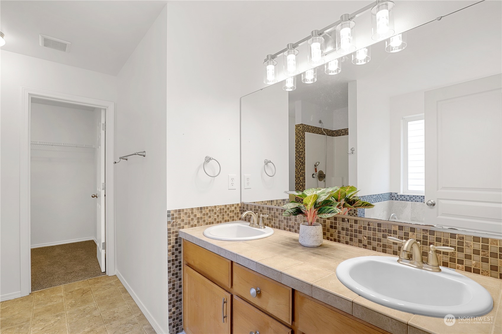 5600 55th Loop Southeast Olympia, WA 98513 - Photo 13 of 33 a bathroom with a sink double vanity and a mirror