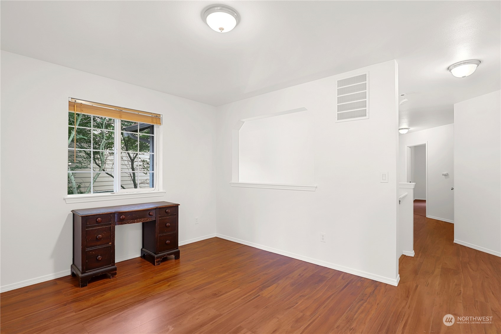 5600 55th Loop Southeast Olympia, WA 98513 - Photo 16 of 33 a view of empty room with wooden floor and fan
