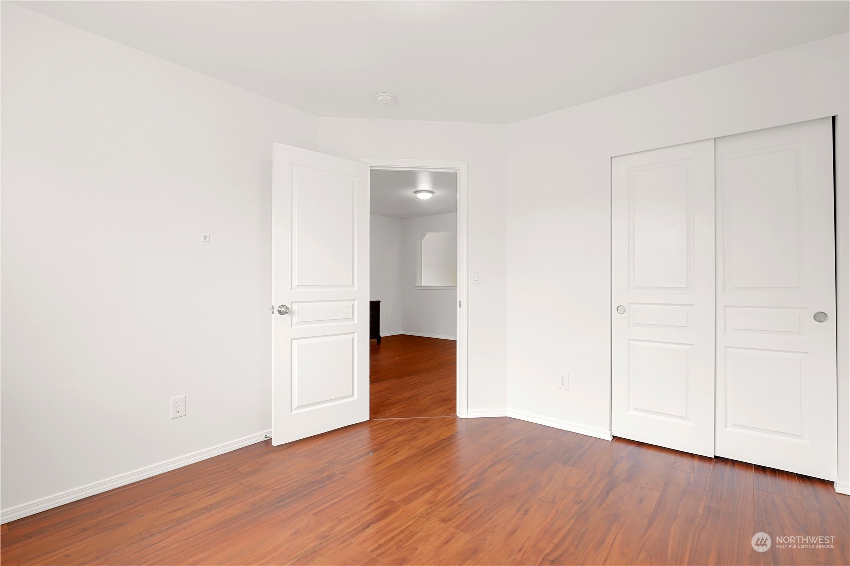 5600 55th Loop Southeast Olympia, WA 98513 - Photo 24 of 33 a view of an empty room with wooden floor