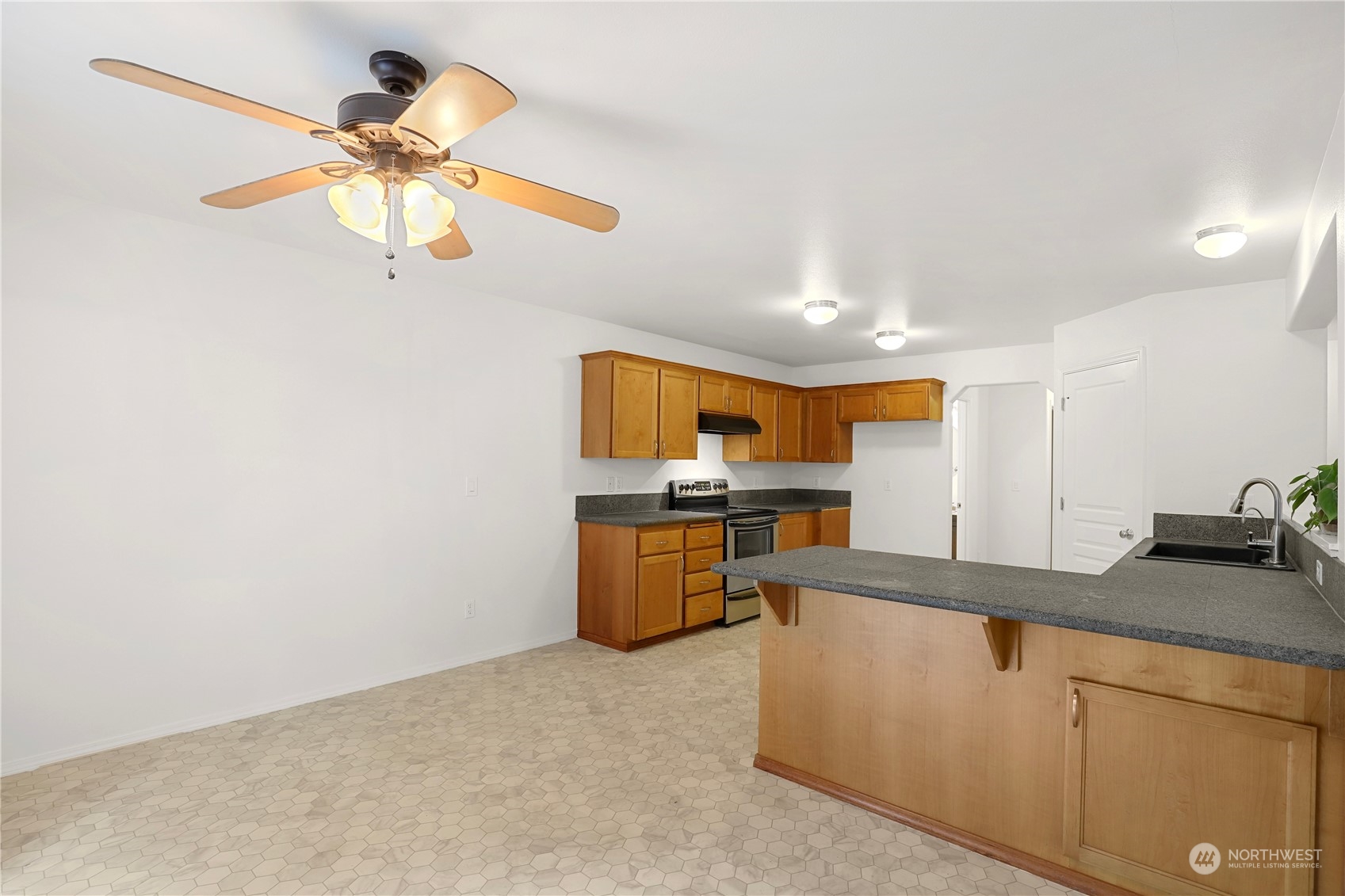 5600 55th Loop Southeast Olympia, WA 98513 - Photo 4 of 33 a kitchen with stainless steel appliances granite countertop cabinets and a sink