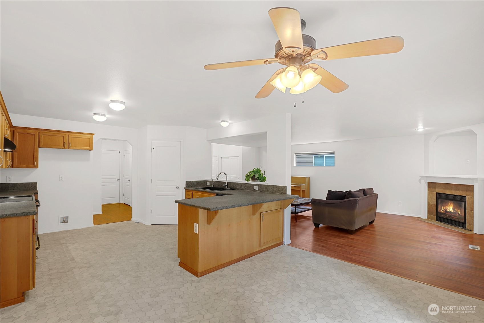 5600 55th Loop Southeast Olympia, WA 98513 - Photo 5 of 33 a living room with furniture and a fireplace