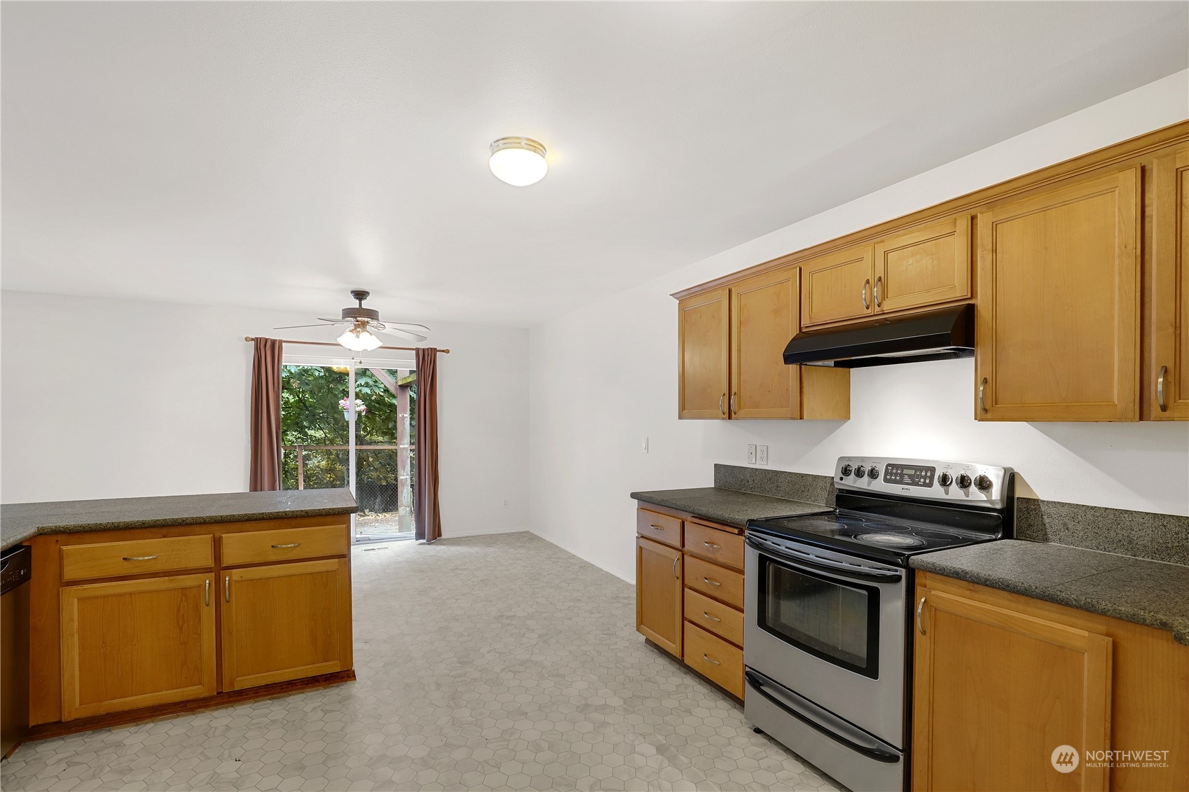 5600 55th Loop Southeast Olympia, WA 98513 - Photo 8 of 33 a kitchen that has a sink and a stove