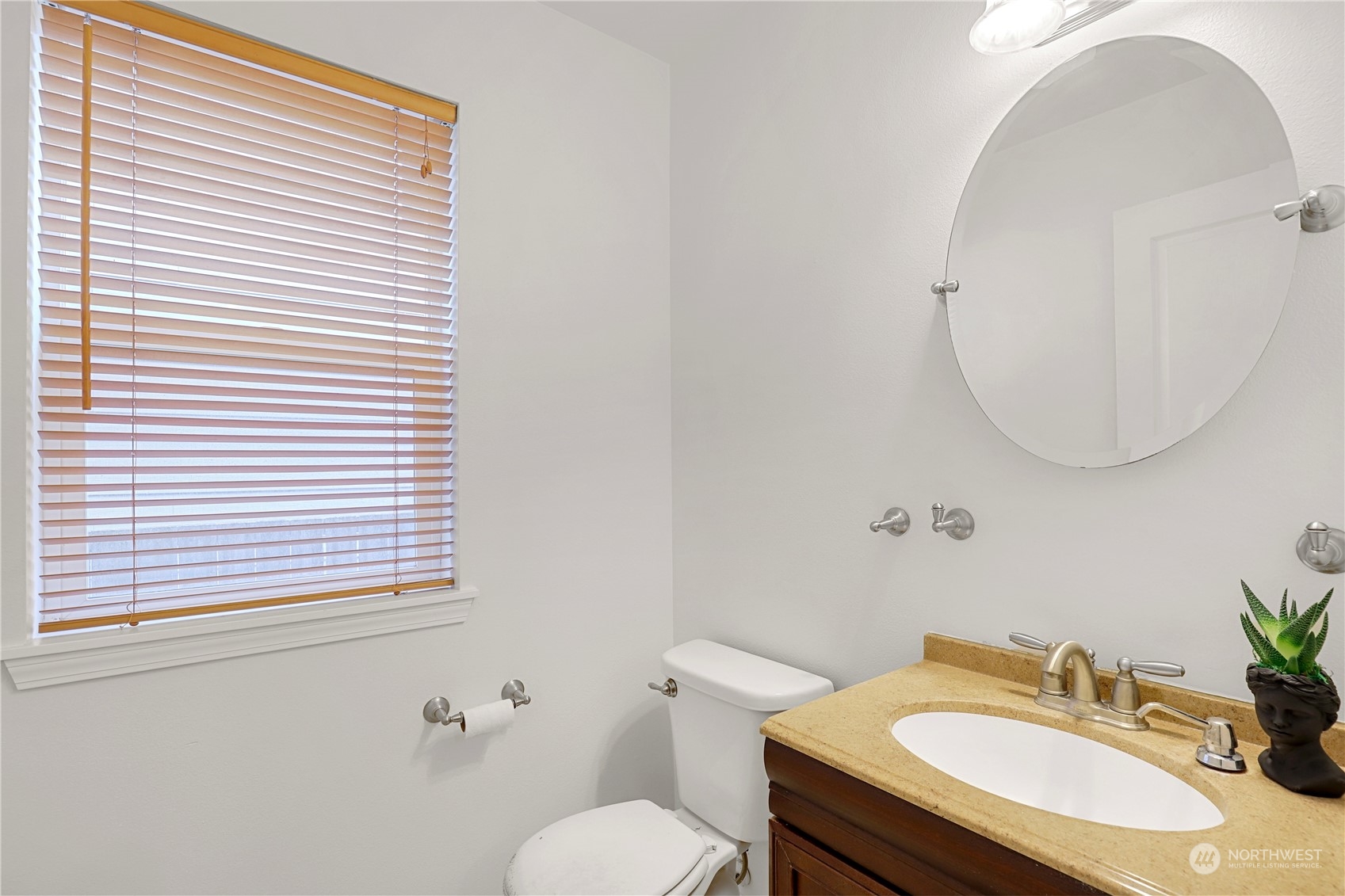 5600 55th Loop Southeast Olympia, WA 98513 - Photo 10 of 33 a bathroom with a sink a toilet and a mirror