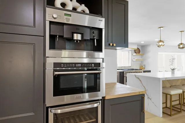 a kitchen with cabinets and appliances
