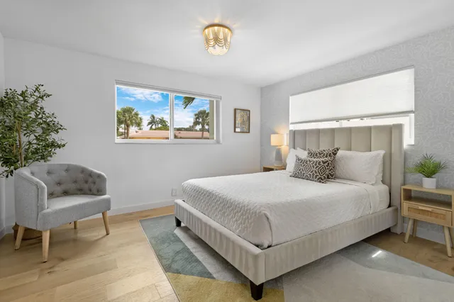 a bedroom with a bed and a couch