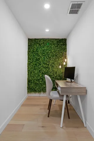 a workspace with furniture and a window