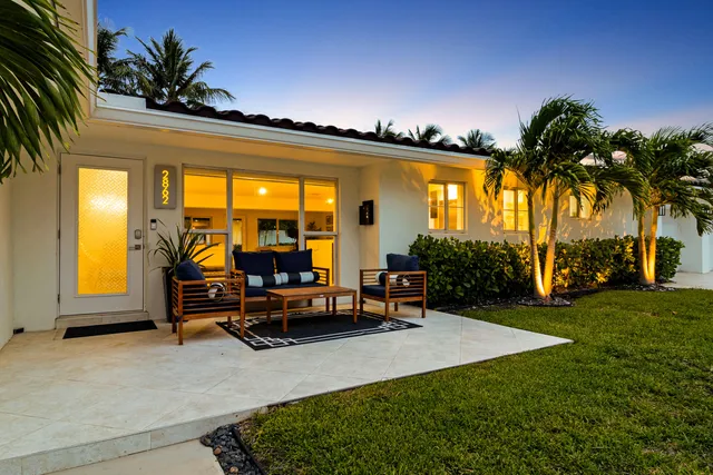 a view of a swimming pool with chairs