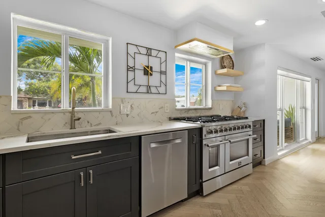 a kitchen with a sink and a window