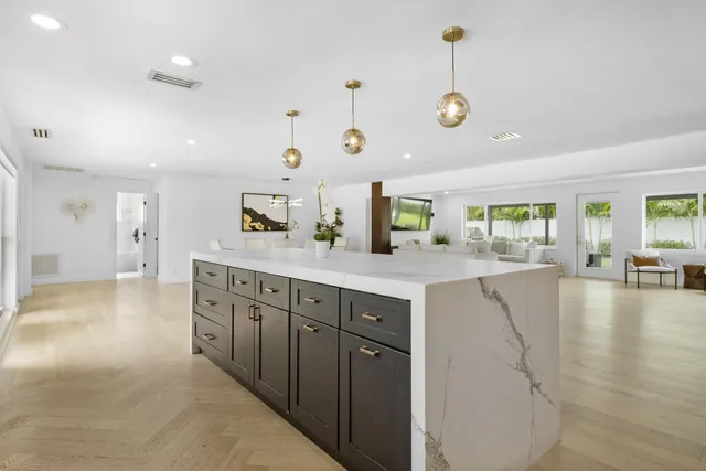 a kitchen with lots of counter space and window