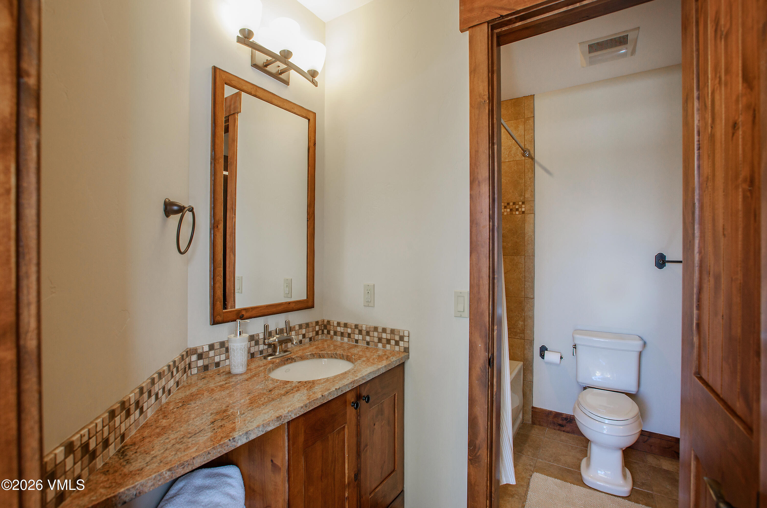 2753 East Haystacker Drive Eagle, CO 81631 - Photo 37 of 41 a bathroom with a granite countertop sink toilet and shower