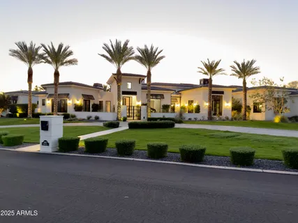 a front view of multiple houses with yard