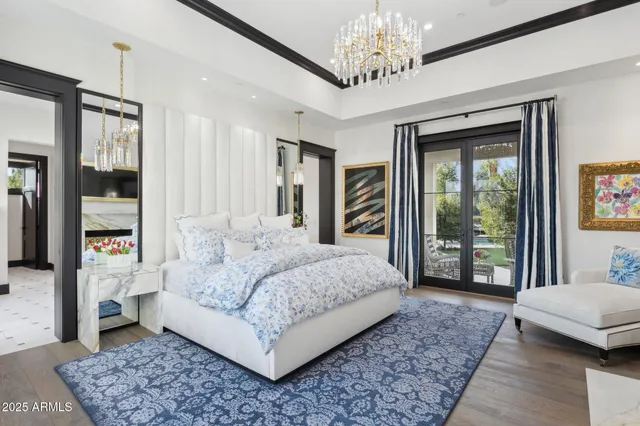 a bed sitting in front of a bedroom next to a window