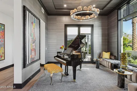 a living room with furniture a rug and a large window