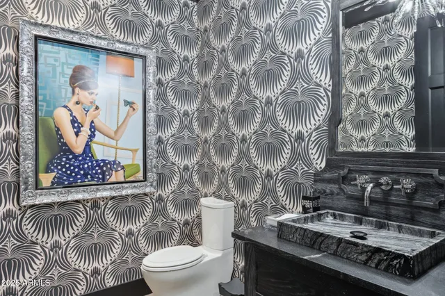 a kitchen with a sink a stove and cabinets