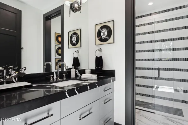 a living room with a floor to ceiling fan and a rug