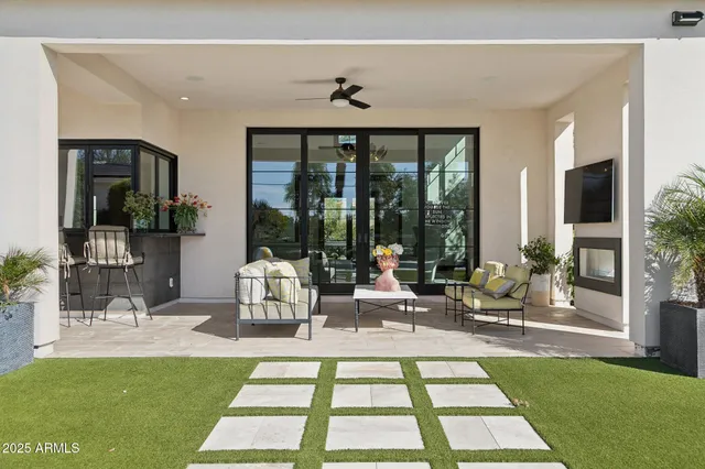 a swimming pool with outdoor seating and yard