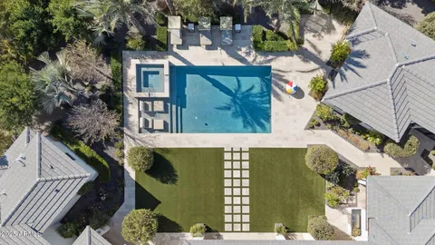an aerial view of multiple houses with outdoor space