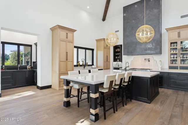 a view of kitchen island with granite countertop living room