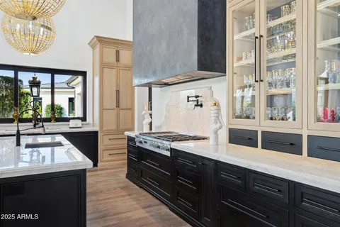 a kitchen with stainless steel appliances wooden cabinets and a stove