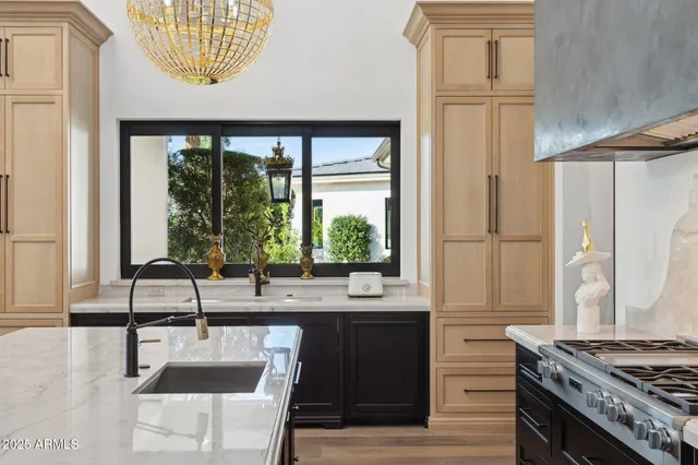 a kitchen with a sink and a window
