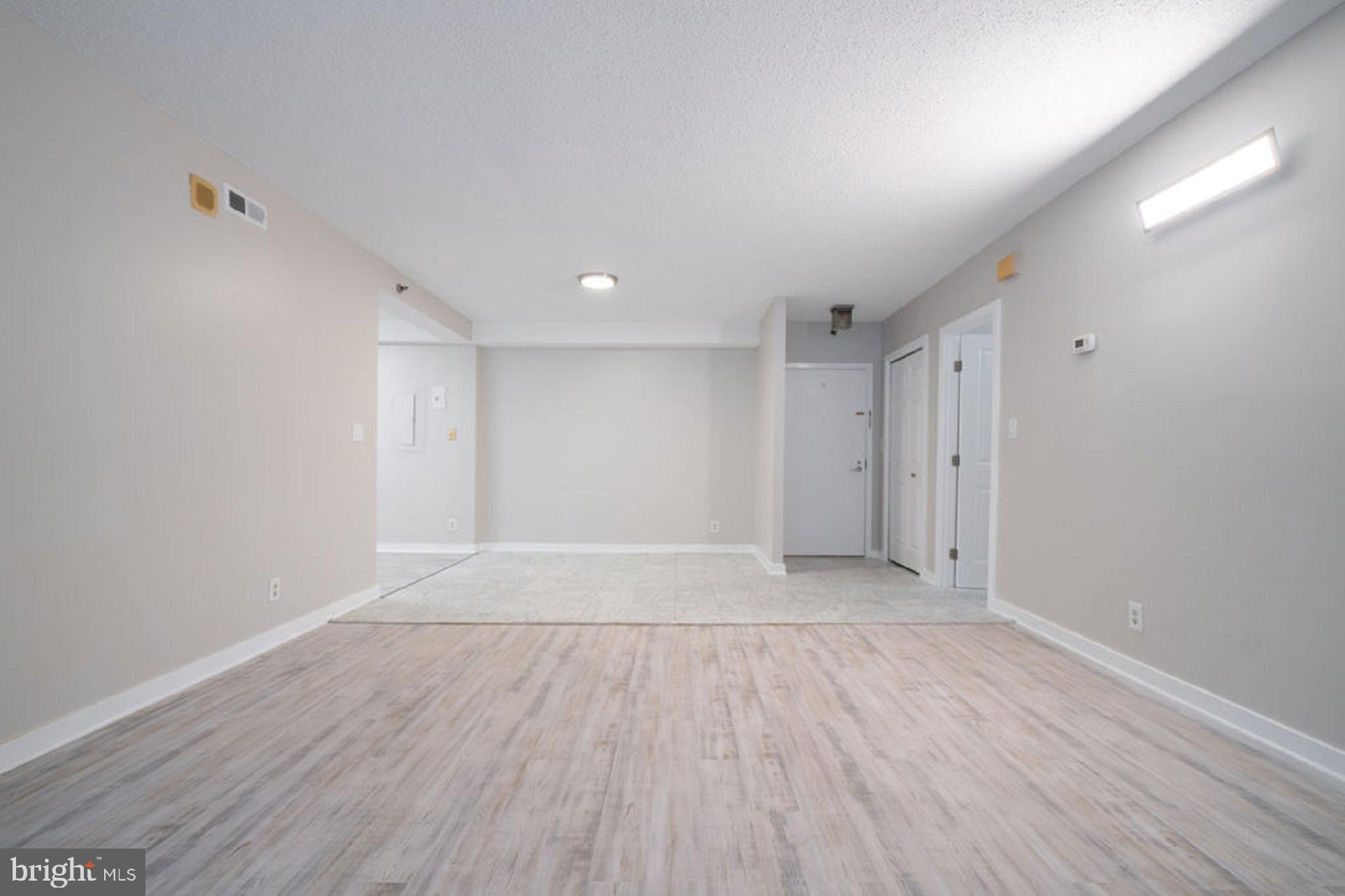 5505 Seminary Road, Unit 103N Falls Church, VA 22041 - Photo 6 of 59 a view of an empty room with wooden floor