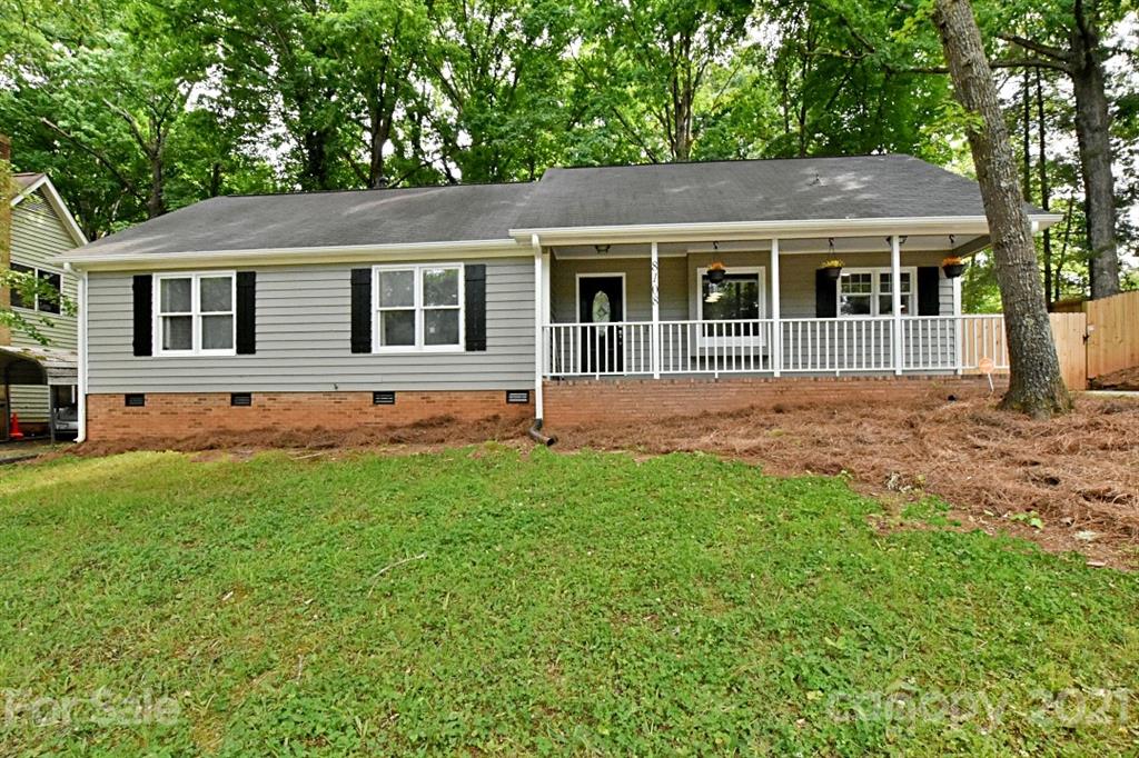 8108 Barncliff Road Charlotte, NC 28227 - Photo 2 of 25 a front view of a house with a garden