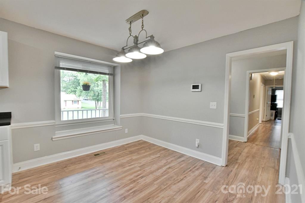 8108 Barncliff Road Charlotte, NC 28227 - Photo 12 of 25 a view of livingroom with hardwood floor and window