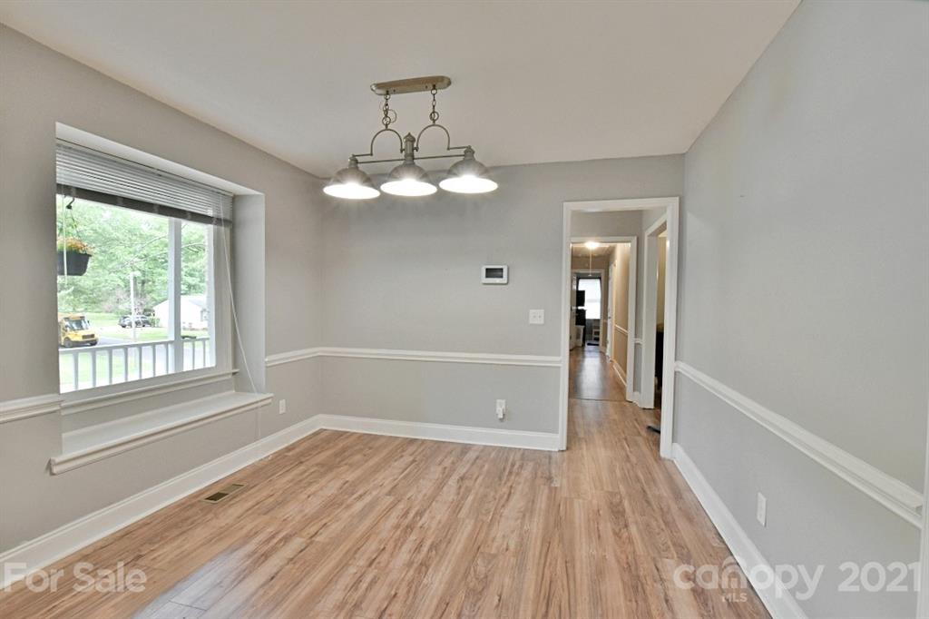 8108 Barncliff Road Charlotte, NC 28227 - Photo 13 of 25 a view of livingroom with hardwood floor and window