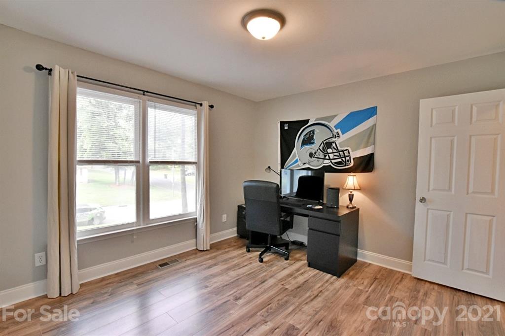 8108 Barncliff Road Charlotte, NC 28227 - Photo 18 of 25 a view of a workspace with furniture and a window