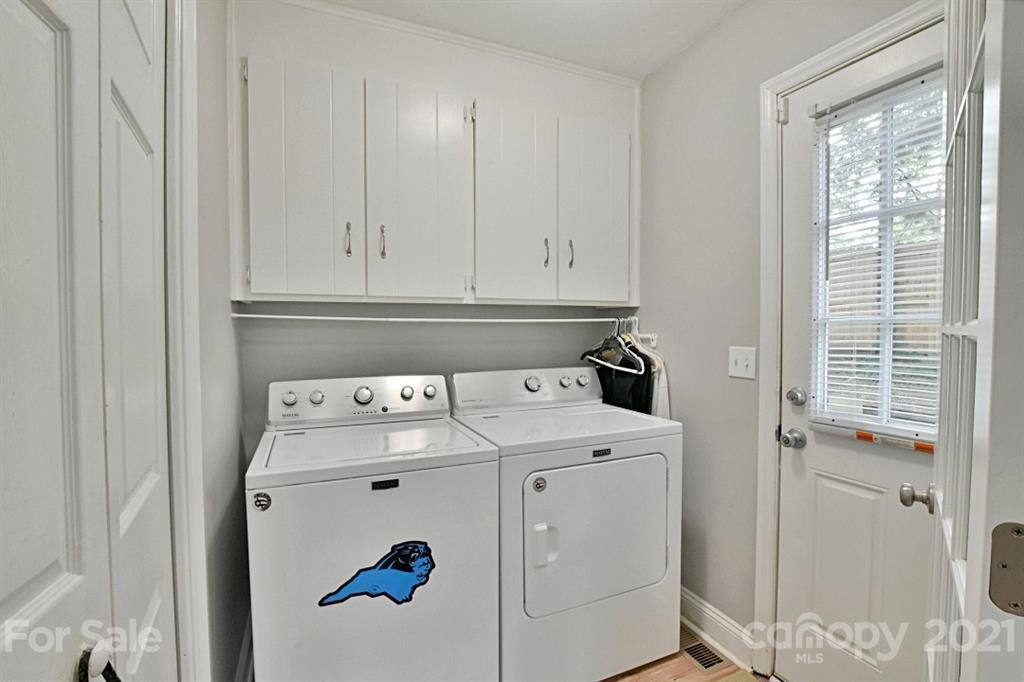 8108 Barncliff Road Charlotte, NC 28227 - Photo 21 of 25 a view of storage and utility room with washer and dryer
