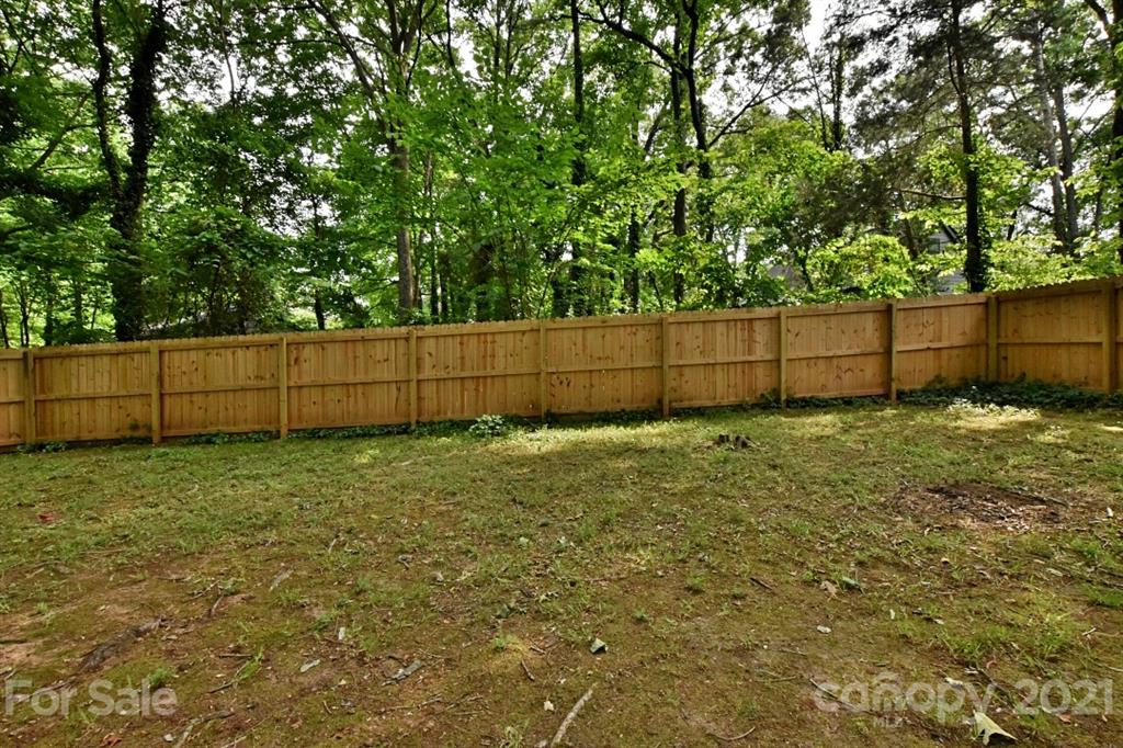 8108 Barncliff Road Charlotte, NC 28227 - Photo 22 of 25 a view of backyard and tree