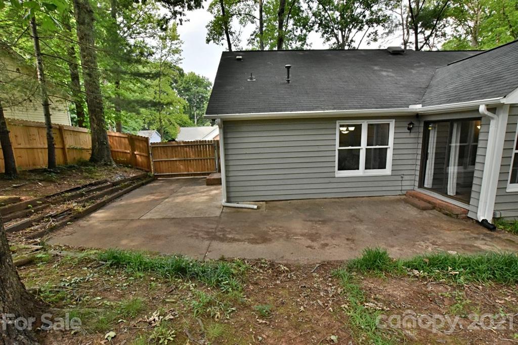8108 Barncliff Road Charlotte, NC 28227 - Photo 24 of 25 a front view of a house with a yard