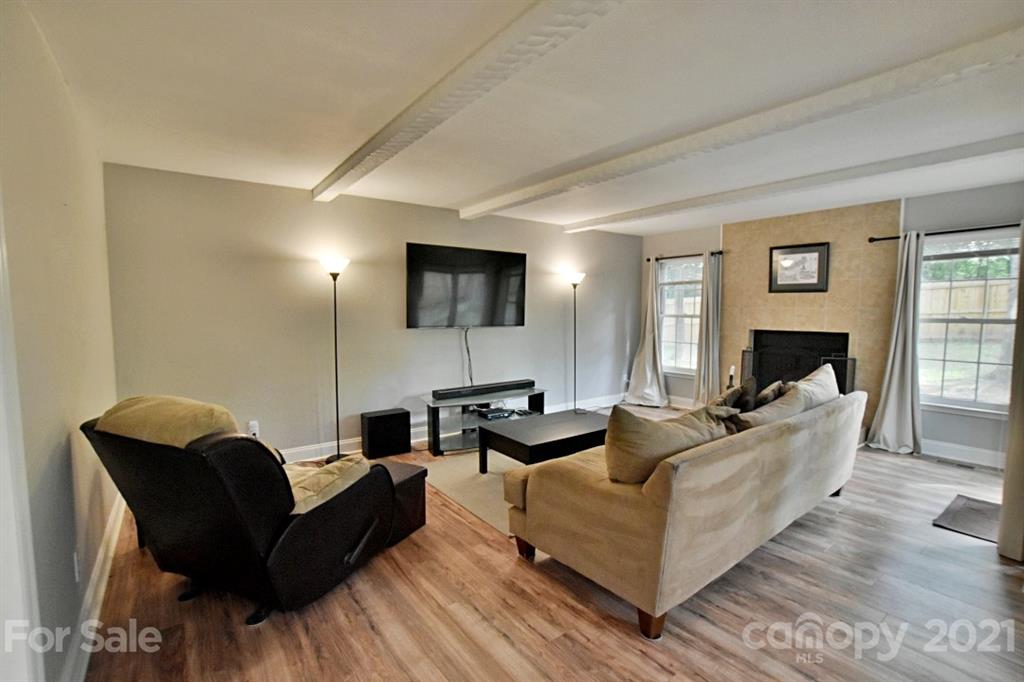 8108 Barncliff Road Charlotte, NC 28227 - Photo 5 of 25 a living room with furniture and a flat screen tv