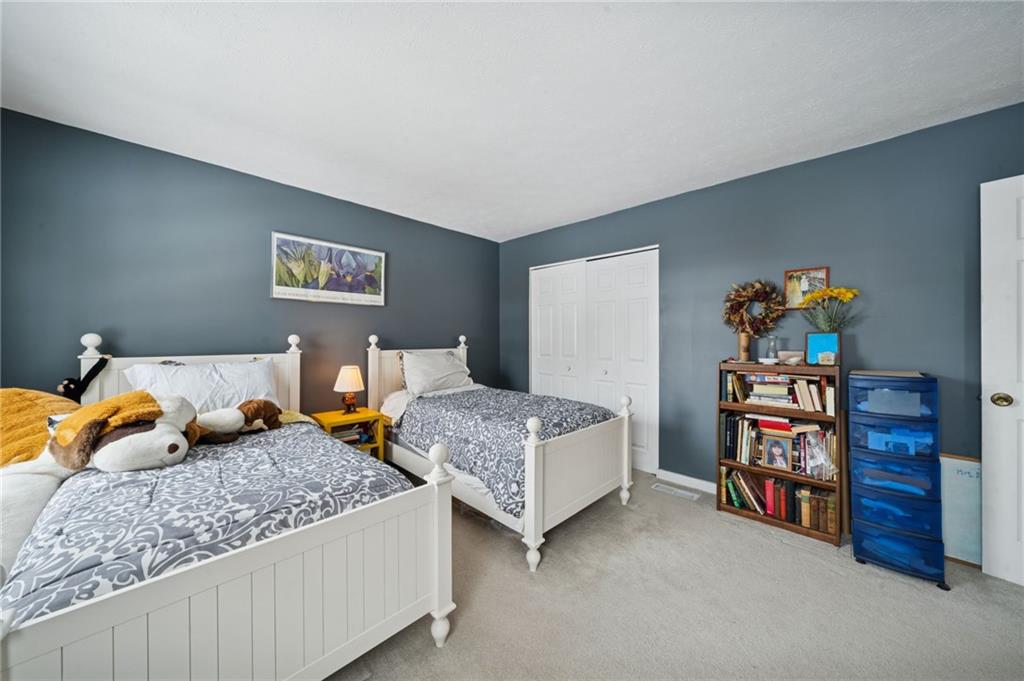 3151 Seneca Court Gibsonia, PA 15044 - Photo 16 of 38 a bedroom with two beds and a book shelf